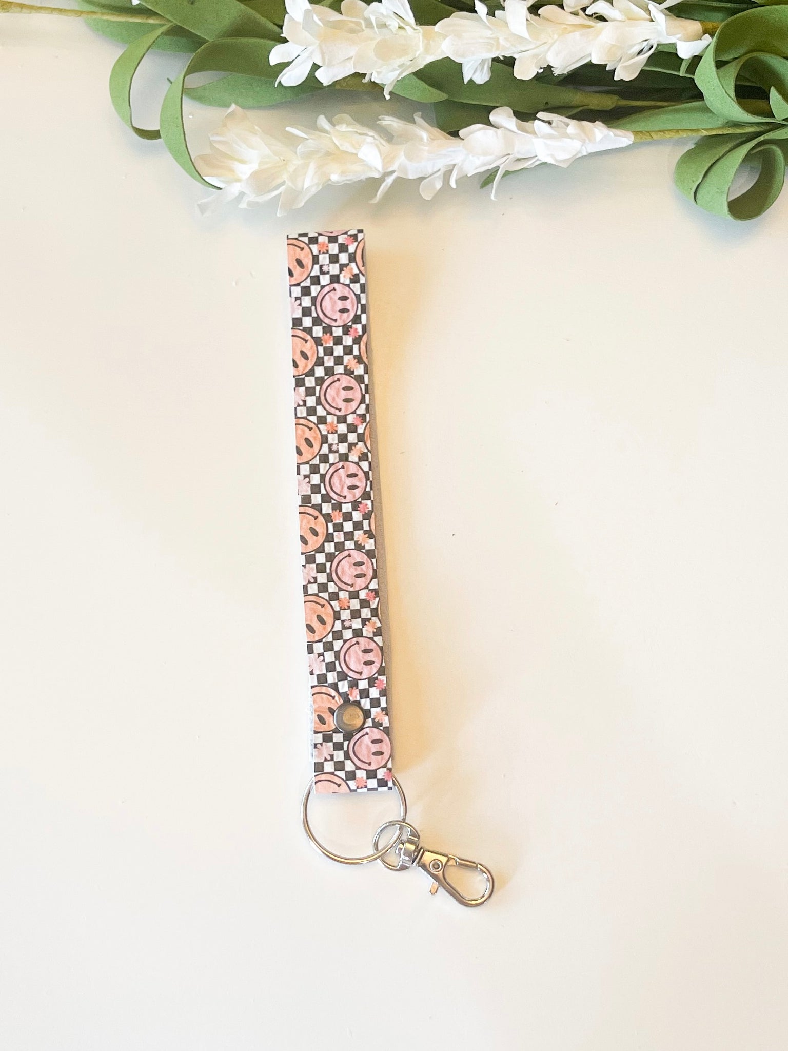 Checkered Happy Face Leather Wrist Strap